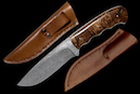 Hunting knife “Hippo“ <br />Blade: damask steel 12.5 cm. <br />Knife handle: Desert Ironwood<br />Overall length: 24 cm <br />CHF 1.250,– <br /><br />